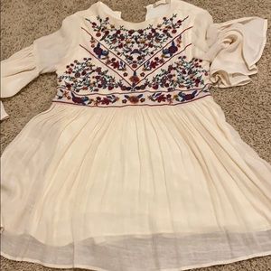 Cream embroidered blouse.